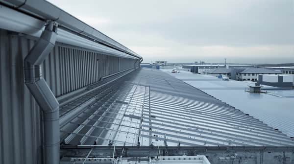 Structural standing seam metal roof installation on a commercial building in Mobile County, Alabama — wind-rated for 140-160 mph Gulf Coast conditions